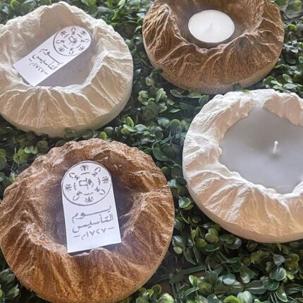 Scented candle with a design of Mount Tuwaiq